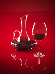 glass of red wine and pitcher