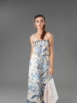 fashionable young woman holding a shopping bag