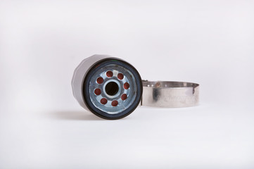 Oil filter and wrench, shallo dof focus on end of filter