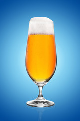 Beer glass on blue background