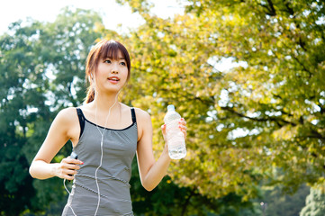 beautiful asian runnning in the park