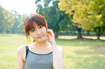 portrait of sporty asian woman in the park