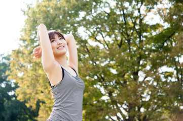 beautiful asian woman exercising in the park