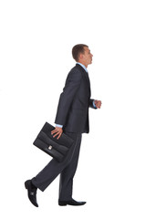 side view hurrying business man with briefcase in hand