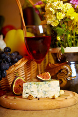 Fototapeta na wymiar Wine and cheese still life