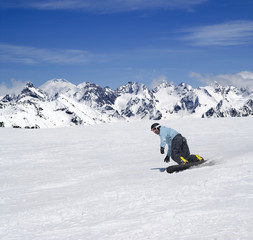 Snowboarder descends a slope