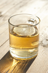 cup of tea with lemon on wooden table