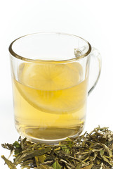 cup of tea with lemon on white