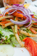 Delicious fresh salad and olive oil
