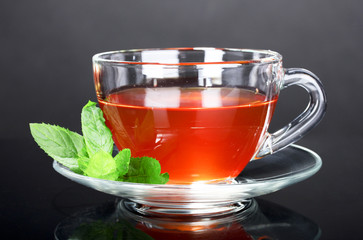 nice cup of tea and mint on black background