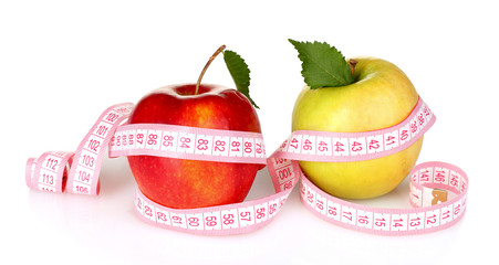 two apples and measuring tape isolated on white