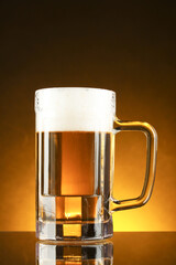 mug of beer on a yellow background