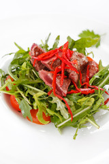 salad with arugula and beef