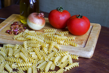 raw fusilli with ingredients
