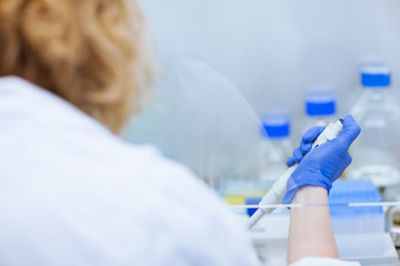 portrait of a female researcher doing research in a lab