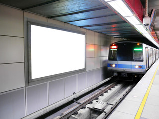 Blank billboard in subway station
