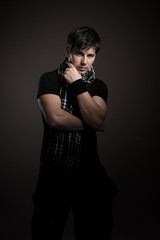 Fototapeta premium Young man. dark background.