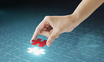 Hand embed missing puzzle piece into place