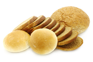 Cut bread and small loaf on a white background
