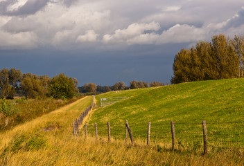 Fototapeta na wymiar Threatening clouds in a Dutch autumn landscape