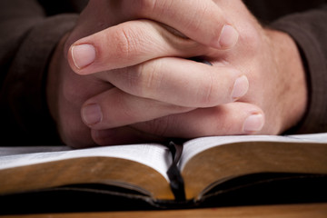 Man Praying with Bible