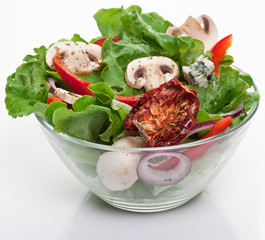 Salad with dried tomatoes, champignon and onion.