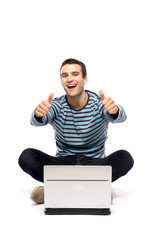 Man with laptop showing thumbs up