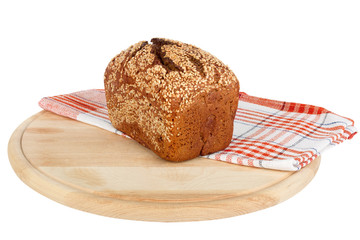 Baked rye bread with linseeds on the white isolated background