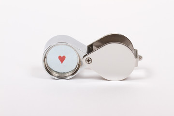 small red heart seen through loupe