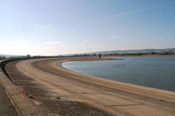 banks of empty reservoir in East Sussex