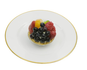 appetizing fruit tart on a plate, isolated