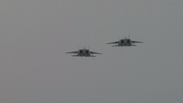 F-15 Falcon fighter planes slow motion fly by