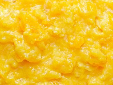 close up of scrambled eggs food background
