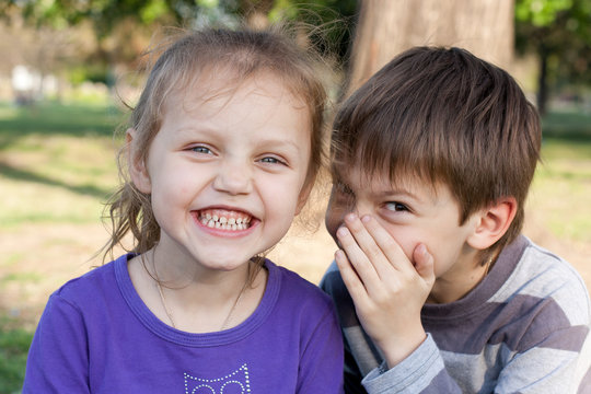 Cute Kids Gossiping In A Park