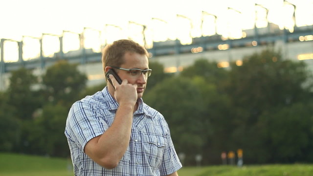 Man with mobile phone, outdoors