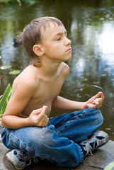 young little  boy meditating