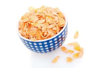 Cornflakes in a blue porcelain bowl
