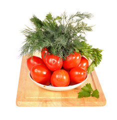 Tomatoes, fennel on a saucer  on a table