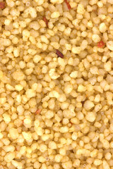 Brown bowl with couscous on white background