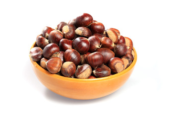 Bowl of chestnuts on white background