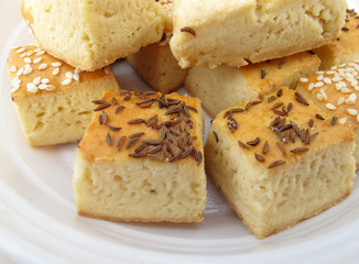 Pile of pastry with sesame and caraway seeds