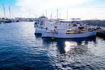 Fototapeta premium fishing boats at sunset in Formentera marina