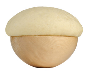 Yeast Dough in Wooden Bowl Isolated on White Background