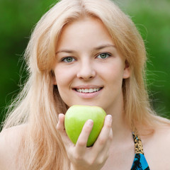 Beautiful woman with green apple