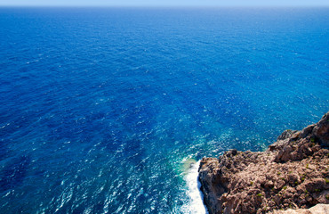 Mediterranean sea foam rocky shore in formentera Barbaria cape