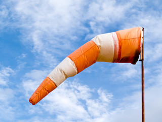 Full wind cone weather vane on windy day