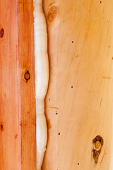 Polyurethane foam seals gap in wood construction