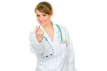 Medical doctor woman making beckoning gesture