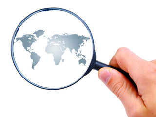 man's hand is searching with magnifying glass