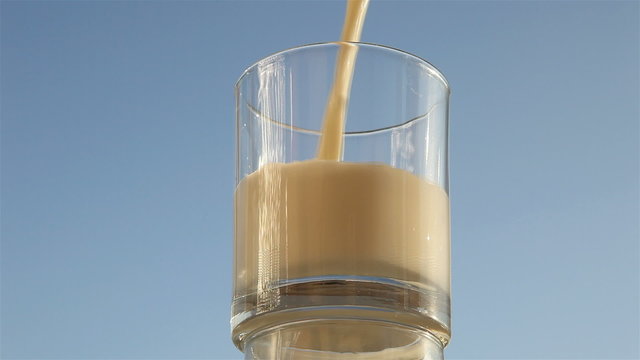 milk poured into a transparent glass